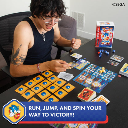 Sonic Roll board game with yellow tiles, blue dice, and game cards displayed on table