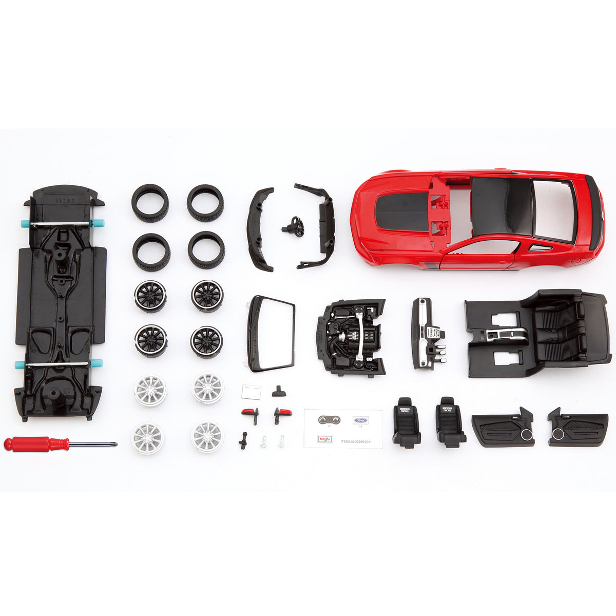 Maisto 1:24 Assembly Line 2012 Ford Mustang Boss 302 red diecast model kit with disassembled parts displayed