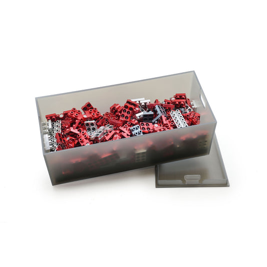 Metomics 3-in-1 Series 001 Ruby Red building set with red and white construction blocks displayed in clear storage organizer box