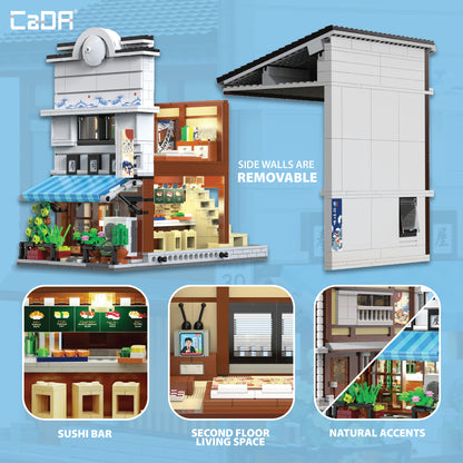 CaDA Japanese Sushi Shop building set with removable side walls, sushi bar, and second floor, featuring blue awning a...