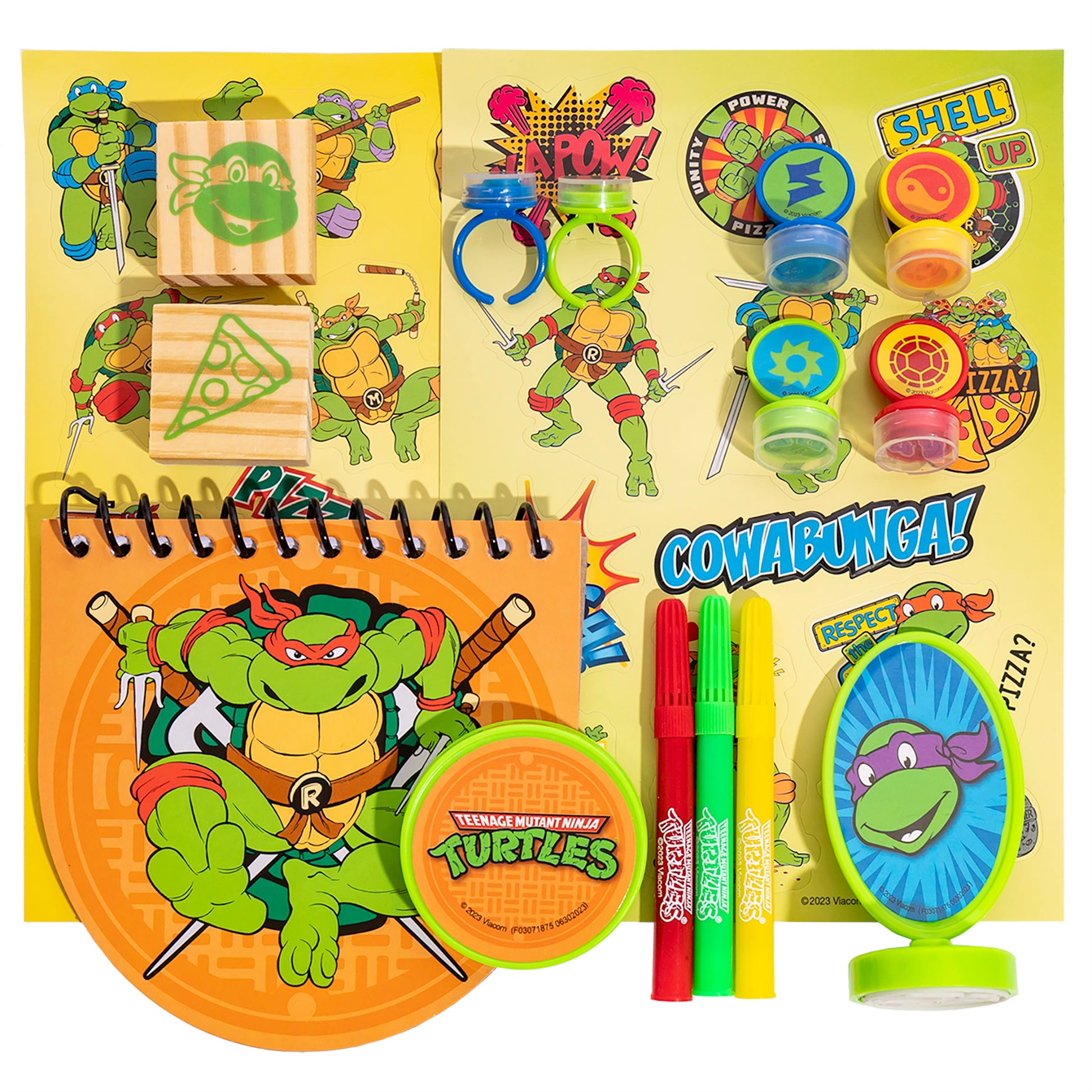 Stamp & Doodle TMNT set with wooden stamps, markers, notebook, and character accessories