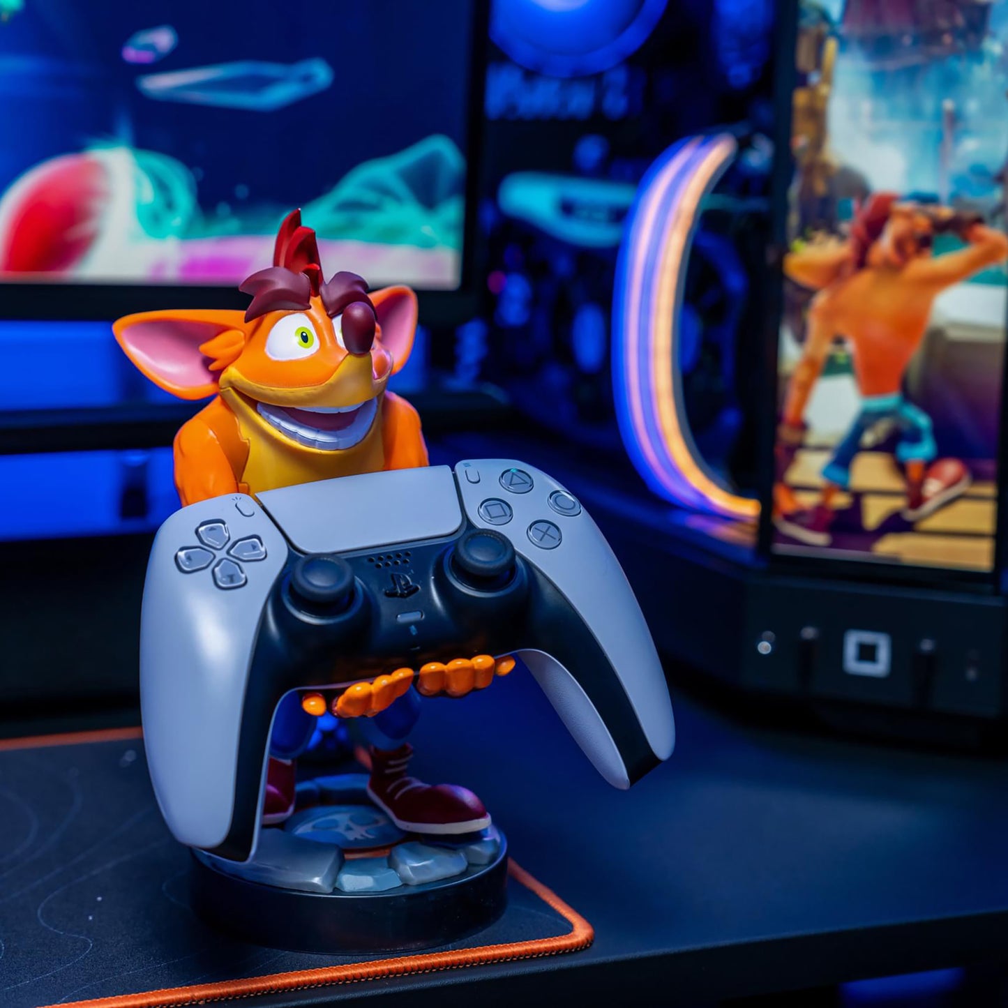 Crash Bandicoot Cable Guys controller holder with orange character figure and white gaming controller