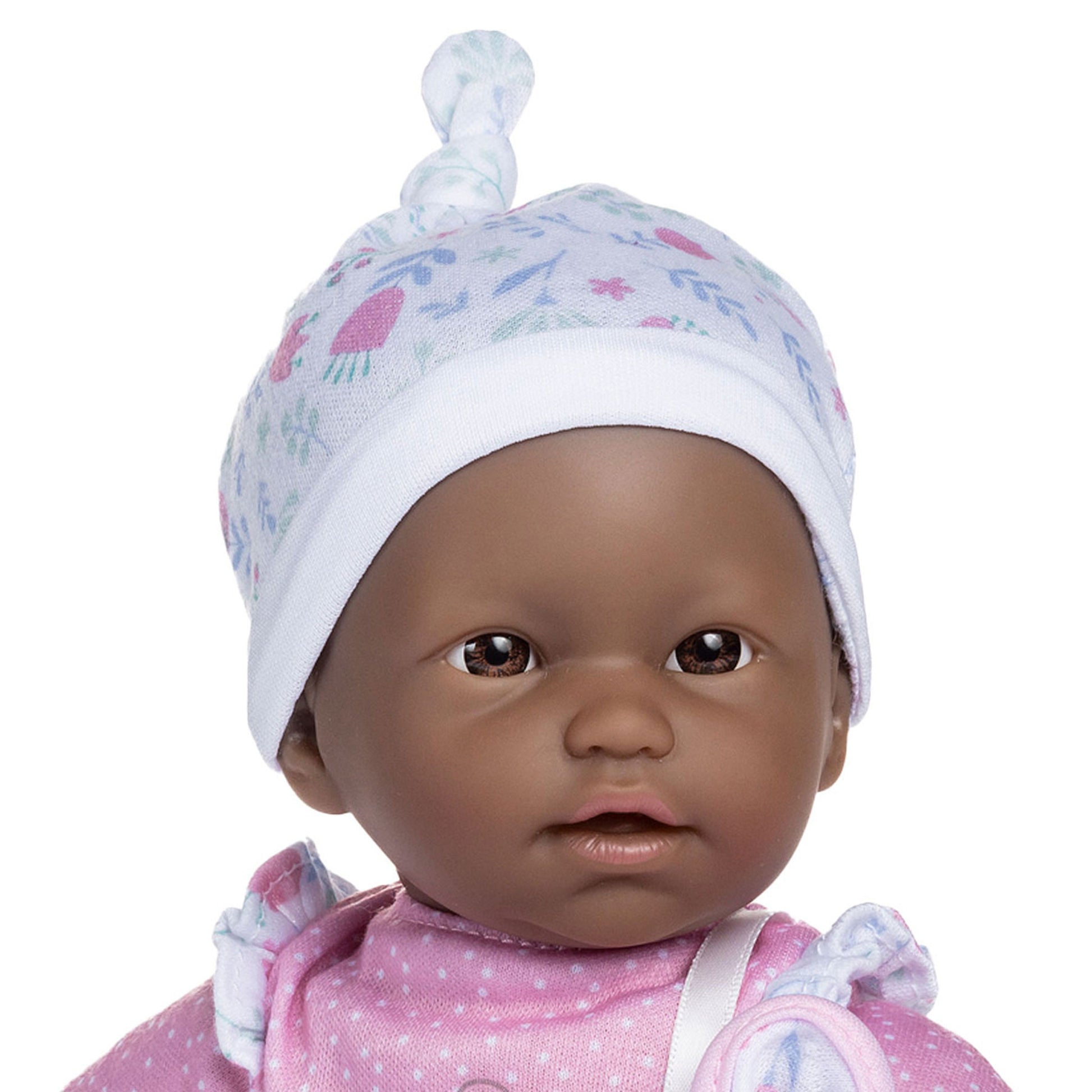 JC Toys La Baby African American doll wearing pink outfit and white hat with blanket