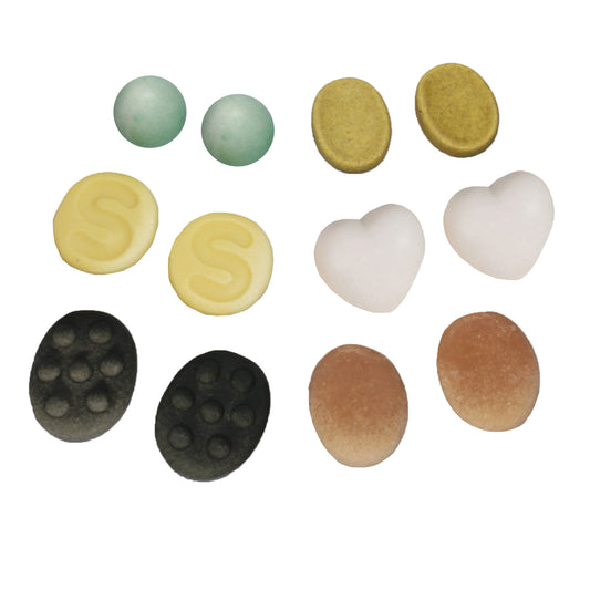 Set of 12 sensory worry stones in various colors and shapes including green spheres, yellow discs with spiral patterns, white hearts, tan ovals, and black ovals