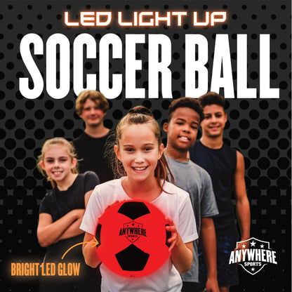 LED Light-Up Soccer Ball in red and black with bright glowing lights, held by smiling child with group of kids behind