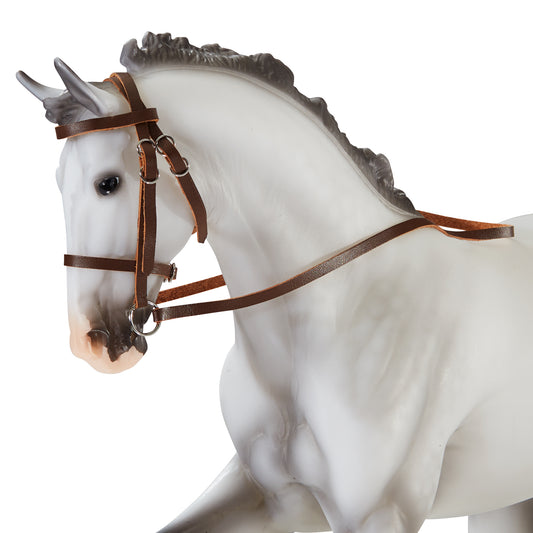 White horse figurine with dark gray mane wearing brown leather hunter/jumper bridle with snaffle design