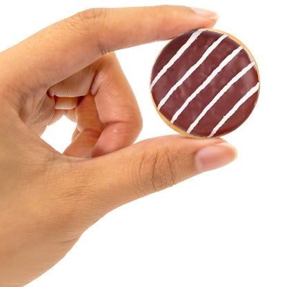 Number Snacks Math Learning Card Game with chocolate frosted donut card featuring white diagonal stripes, held in hand