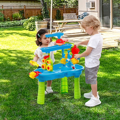Trimate Sand & Water Table - 3 Tier with blue basin, green legs, and colorful accessories including watering can and ...