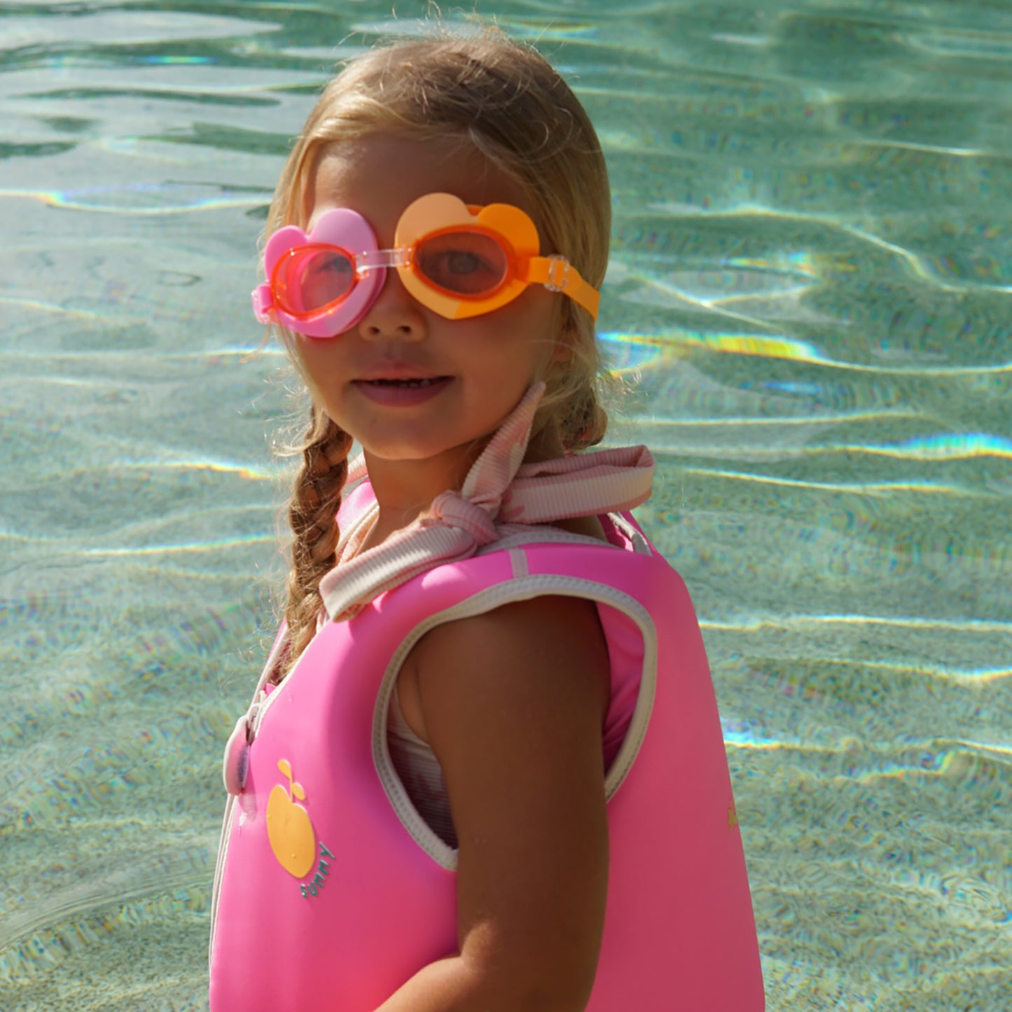 Poppy the Peach swimming goggles in pink and orange heart shapes