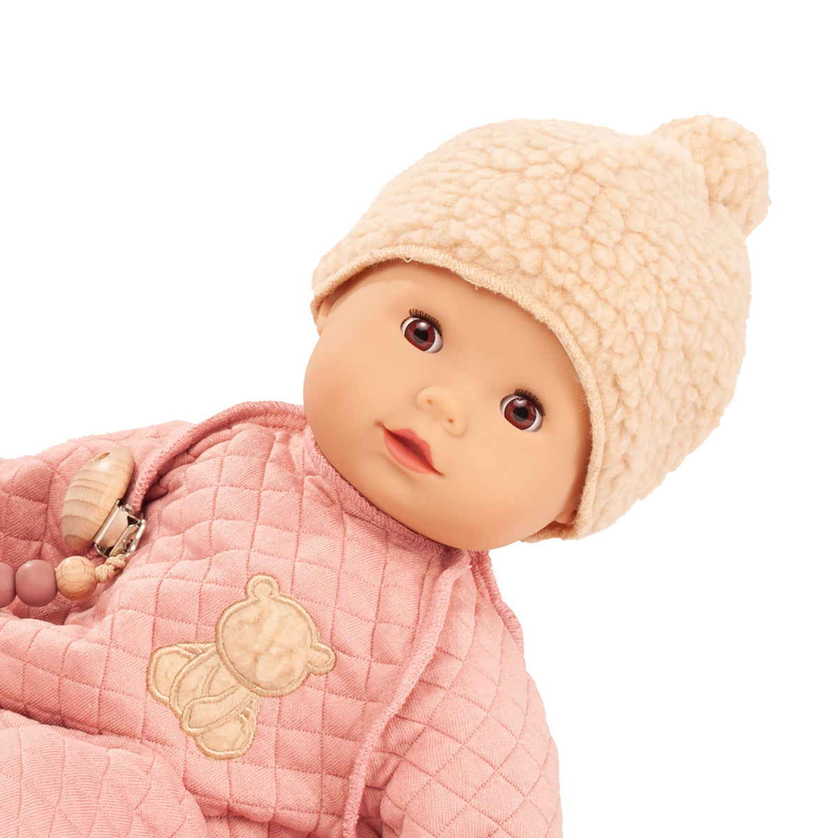 Gotz Maxy Muffin Little Bear baby doll wearing pink quilted jacket and cream knit hat