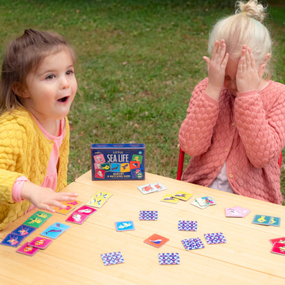 Little Sea Life Memory & Matching Game played by two children outdoors with colorful card tiles