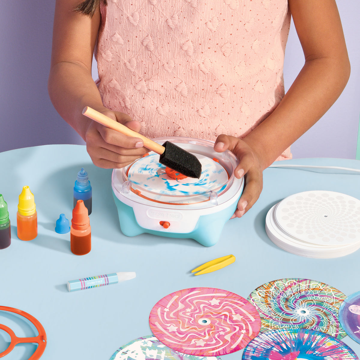 Make It Real Spin Art Studio with girl using brush on spinning platform with colorful inks