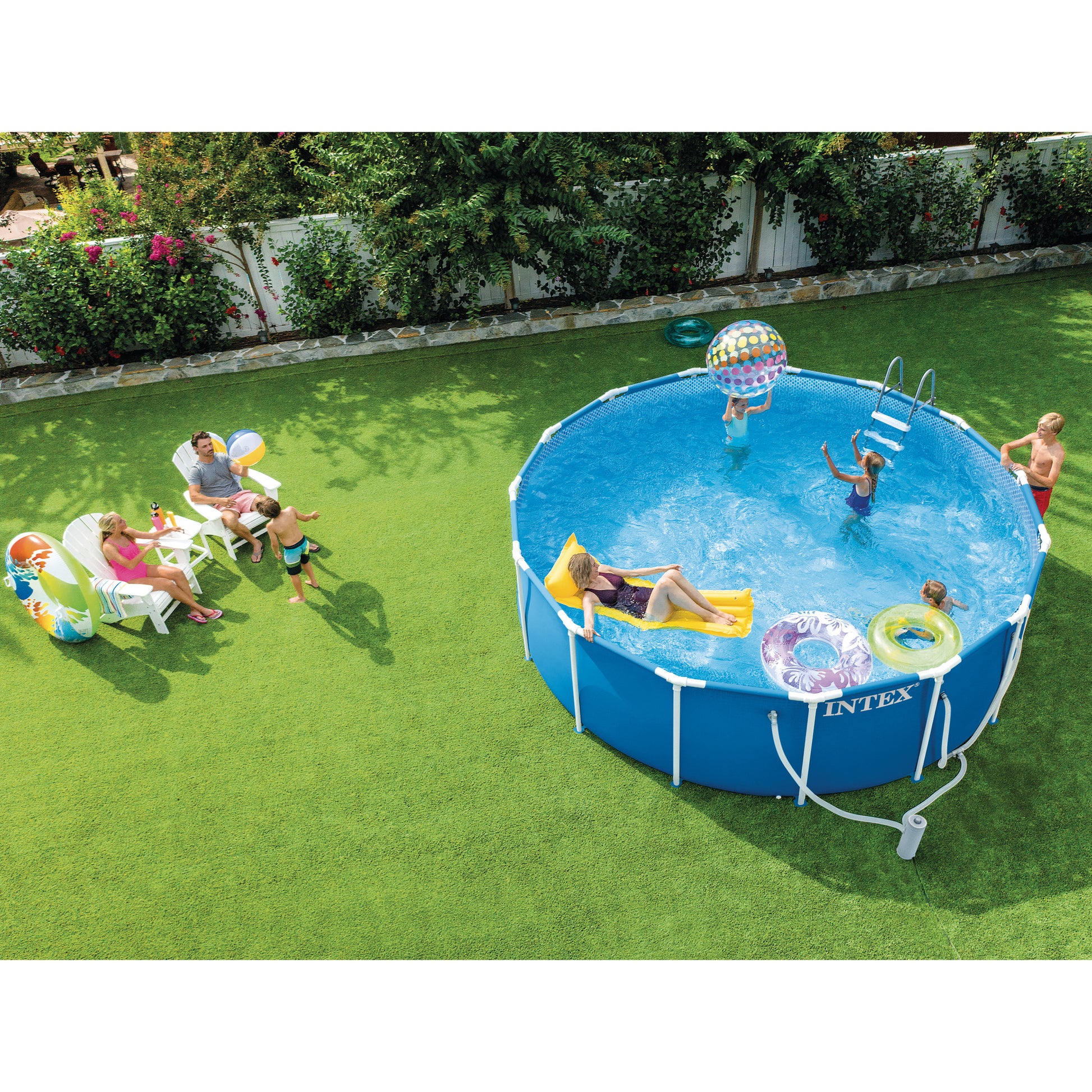 Intex 15' Metal Frame Pool Set with filter pump, ladder, and blue cover in backyard