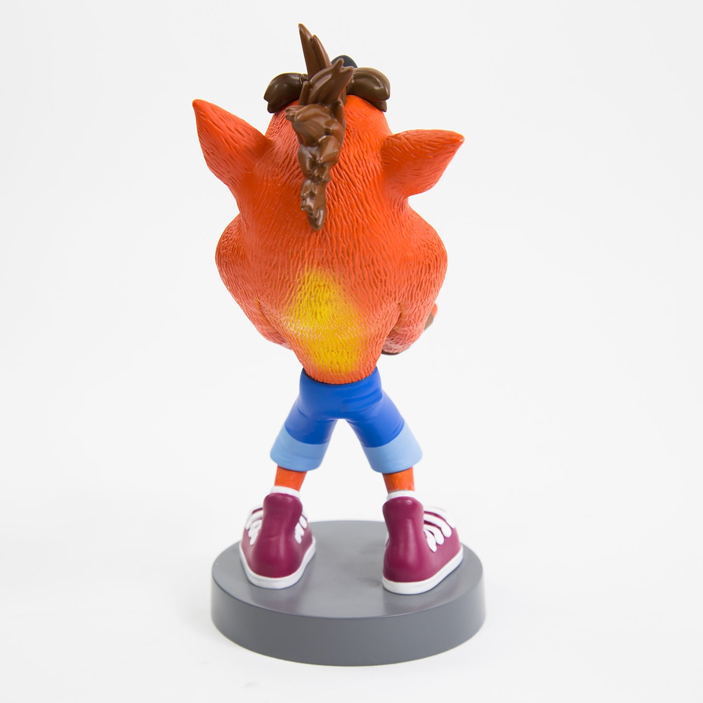 Crash Bandicoot Cable Guys phone holder figure with orange body and blue shorts