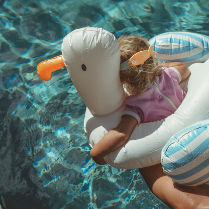 Sammy the Seagull blue stripe pool ring float with child in swimming pool
