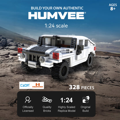 CaDA Humvee 1:24 scale building set with white and red military vehicle on desert terrain