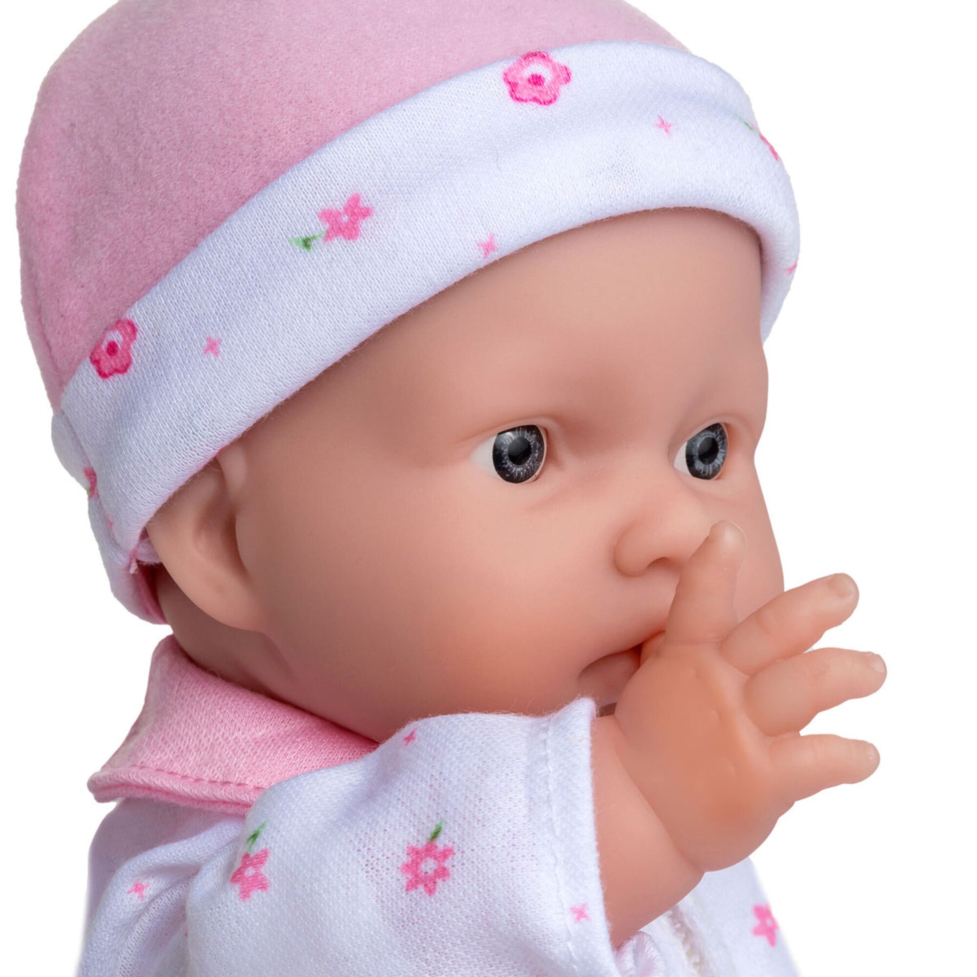 JC Toys La Baby 11 inch soft body doll wearing pink outfit and white floral headband