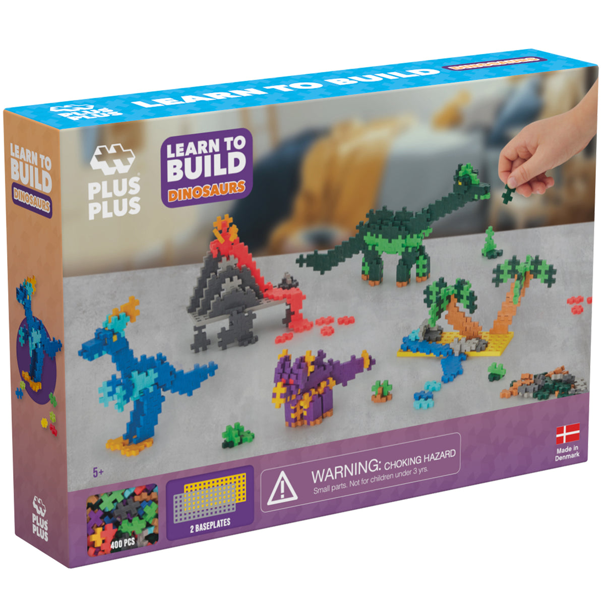Plus-Plus Learn to Build Dinosaurs 400-piece set with colorful interlocking blocks forming blue, purple, and green di...