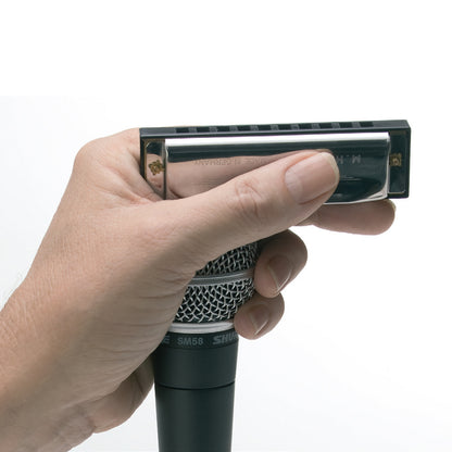 Hinkler Retro Box Harmonica in black held in hand against white background