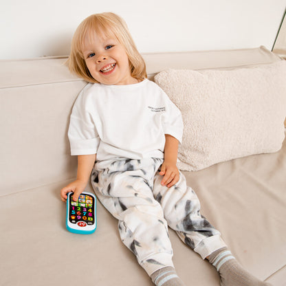Kids Hits Smart Phone toy with light-up screen showing numbers and colors, held by smiling toddler