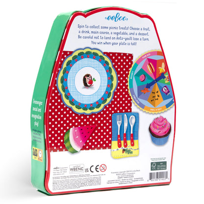 Spin to Play: Picnic Game board game box showing spinner wheel, game board with picnic-themed spaces, plastic food pieces including watermelon and cupcake, and