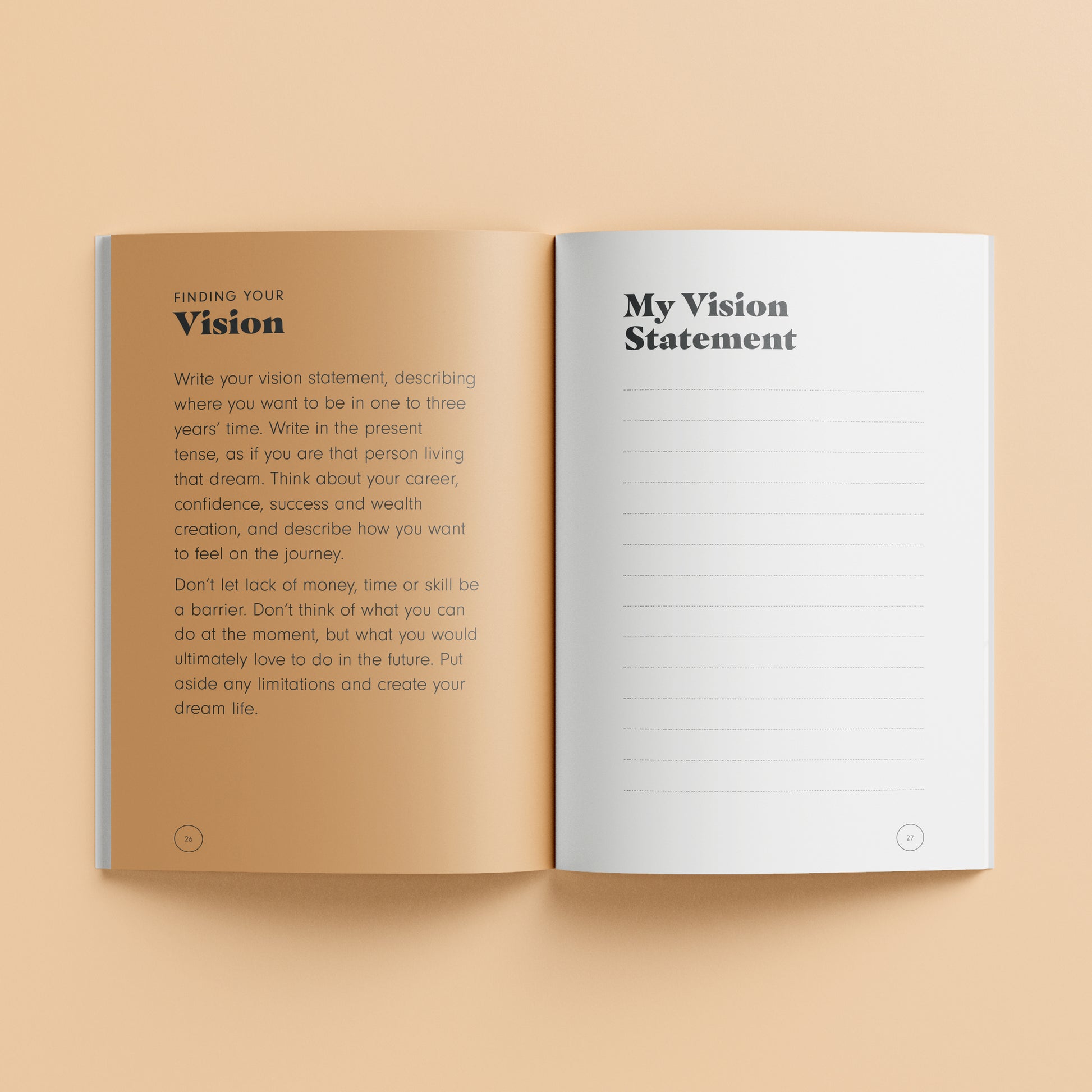 Elevate Vision Board Kit open book showing vision statement worksheet with tan and white pages