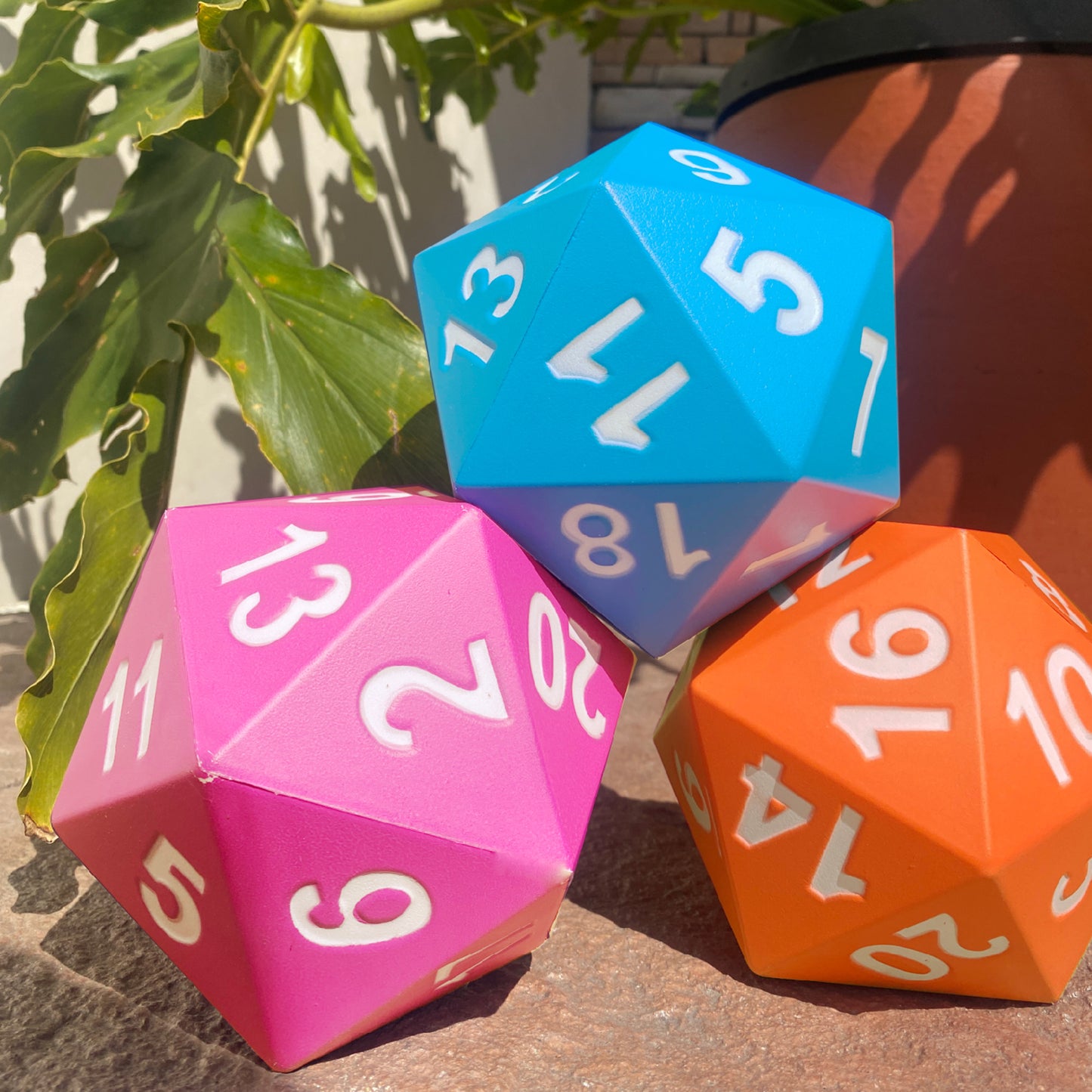 KESS Giant D20 Foam Dice set in blue, pink, and orange with white numbers