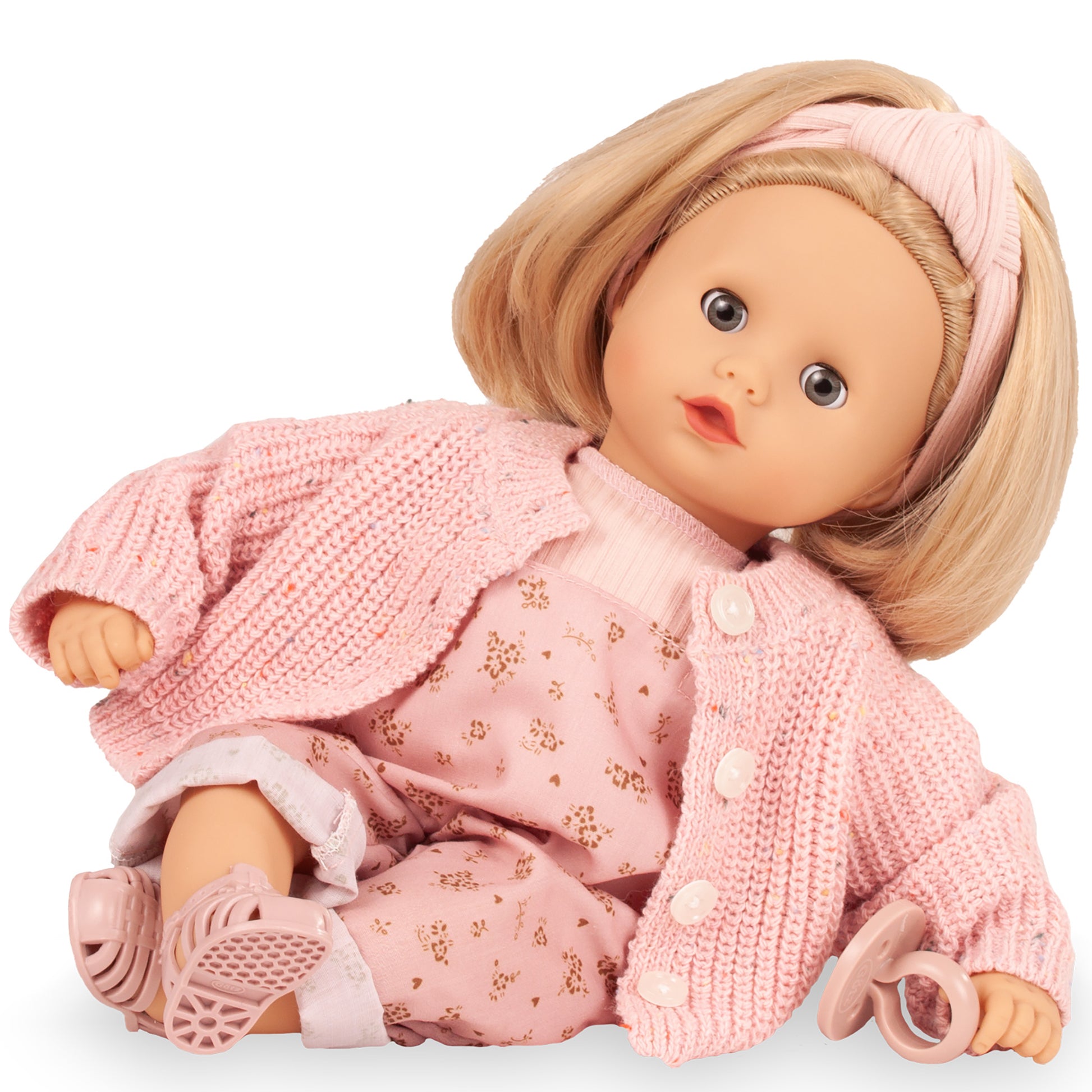 Gotz Muffin 13" doll with blonde hair, pink knit cardigan, and floral overalls