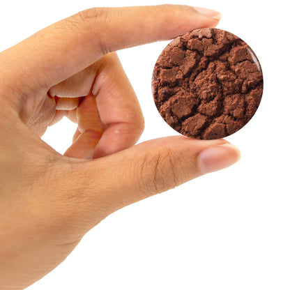 Snacks Blend chocolate cookie toy held in hand against white background