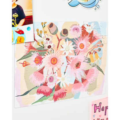 JOS Magnetic Puzzle Flowering Gum with colorful pink and white flowers on wooden board