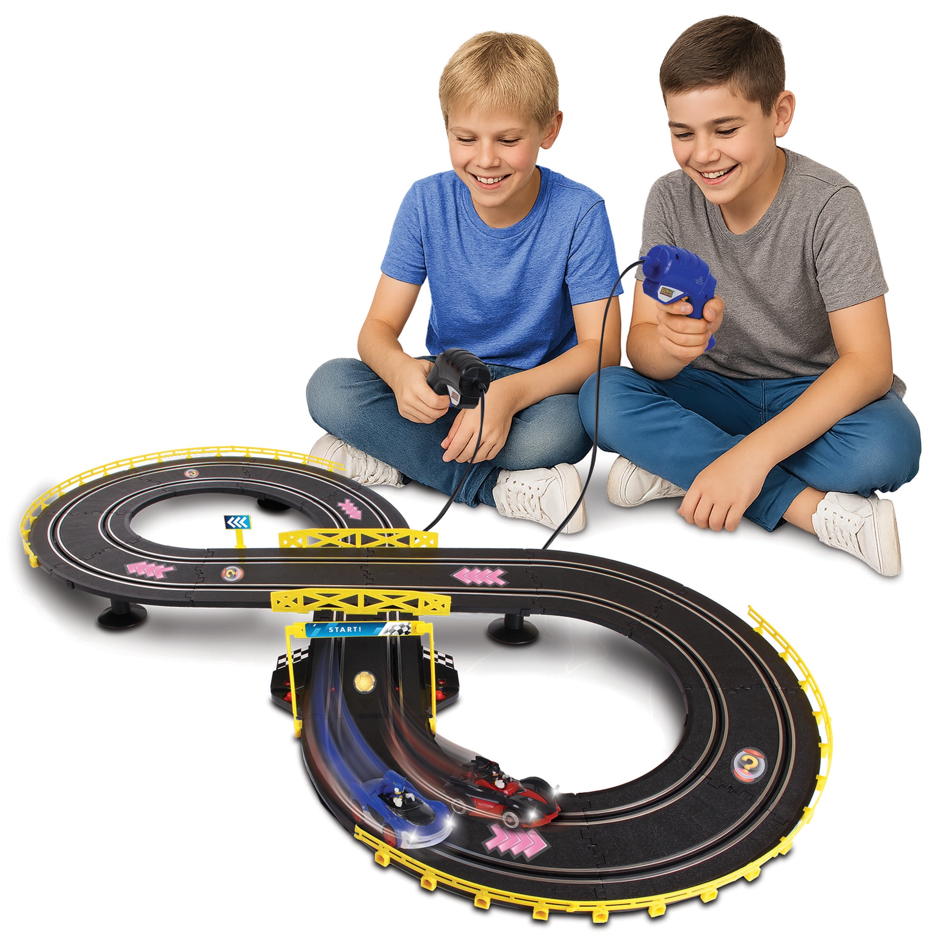 NKOK Sonic Crossworlds Slot Car Race Set with two boys playing, featuring blue and red race cars on black track with ...
