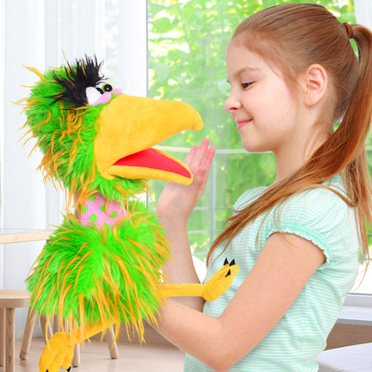 Living Puppets: Pickle The Bird hand puppet with green and yellow feathers, yellow beak, held by smiling child