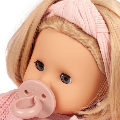 Gotz Muffin Flowers doll with blonde hair, pink headwrap, and pacifier