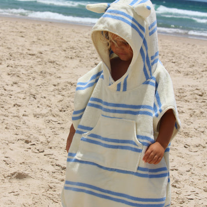 Sammy the Seagull blue striped hooded towel worn by child at beach
