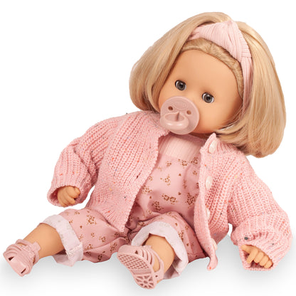 Gotz Muffin Flowers doll with blonde hair, pink knit cardigan, and floral overalls