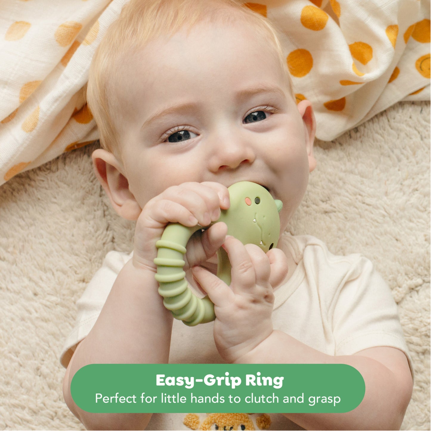 Tiger Tribe Dino Silicone Teether in green, baby chewing toy with easy-grip ring design