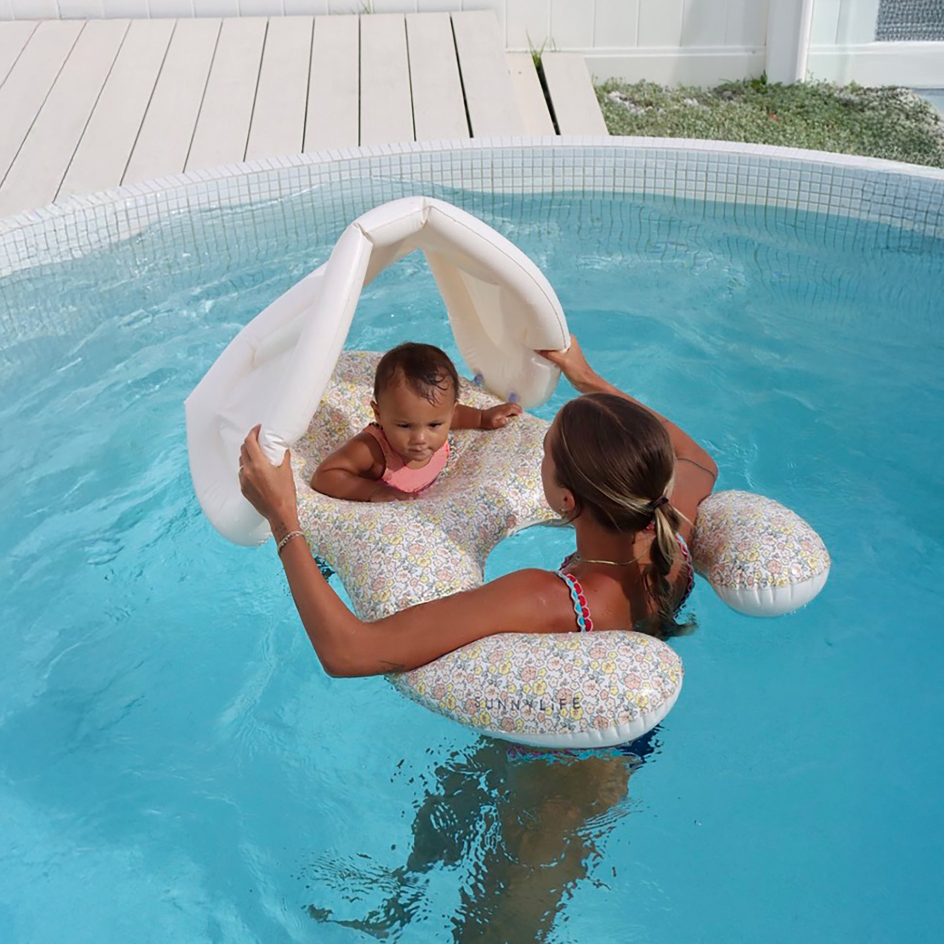 Float Together Baby Seat in Ditsy Floral with adult in pool