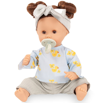 Gotz Sleepy Aquini 13" baby doll with brown hair buns, blue duck print shirt, pacifier