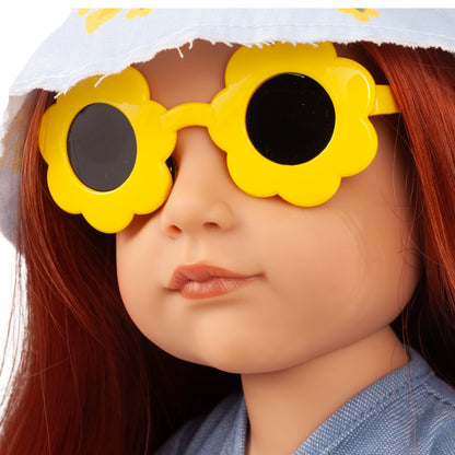Gotz Hannah Little Duck 19.5" doll wearing yellow flower-shaped sunglasses, white hat, and blue dress