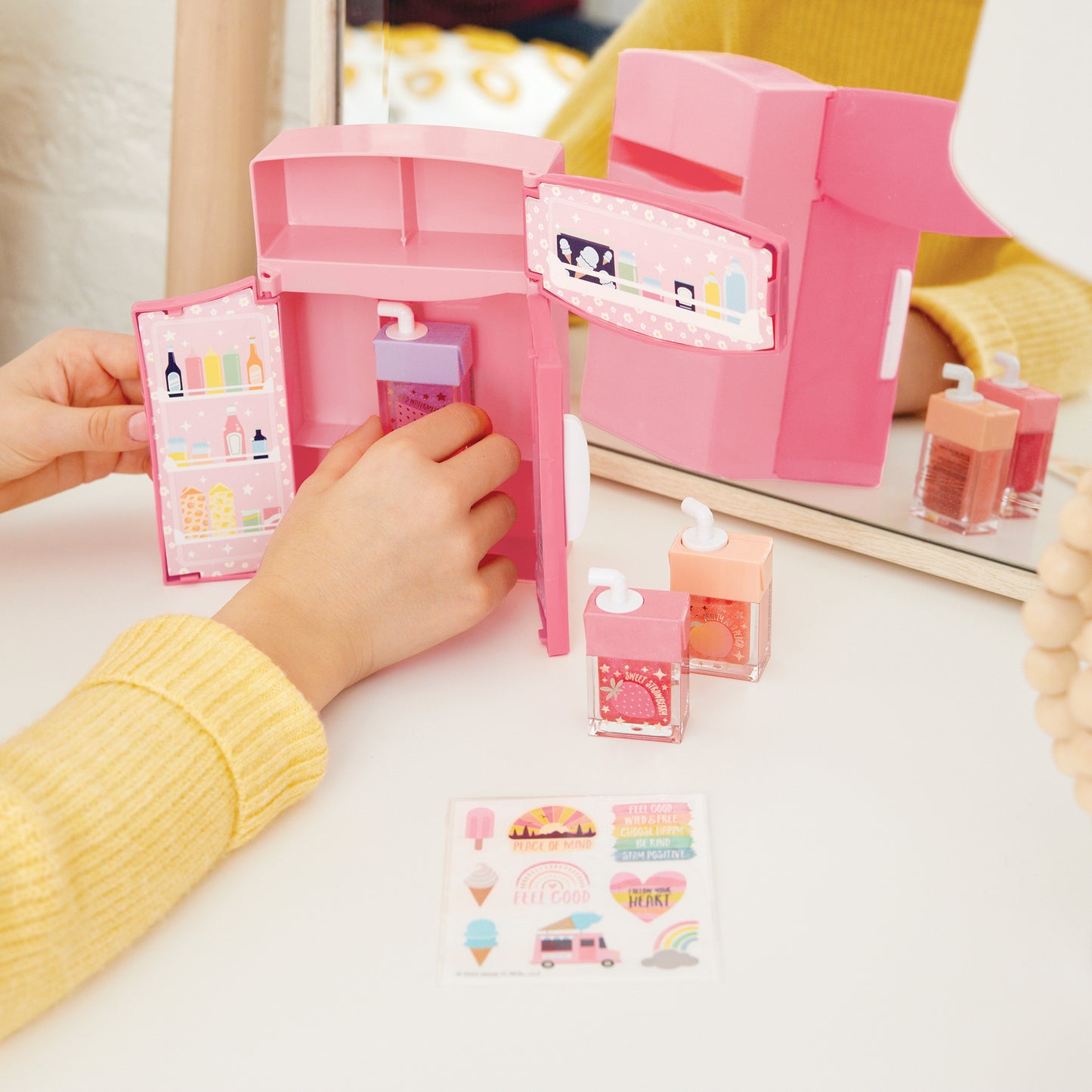 Glimmer & Glow Mini Fridge Lip Gloss Set with pink toy fridge and fruit-scented glosses