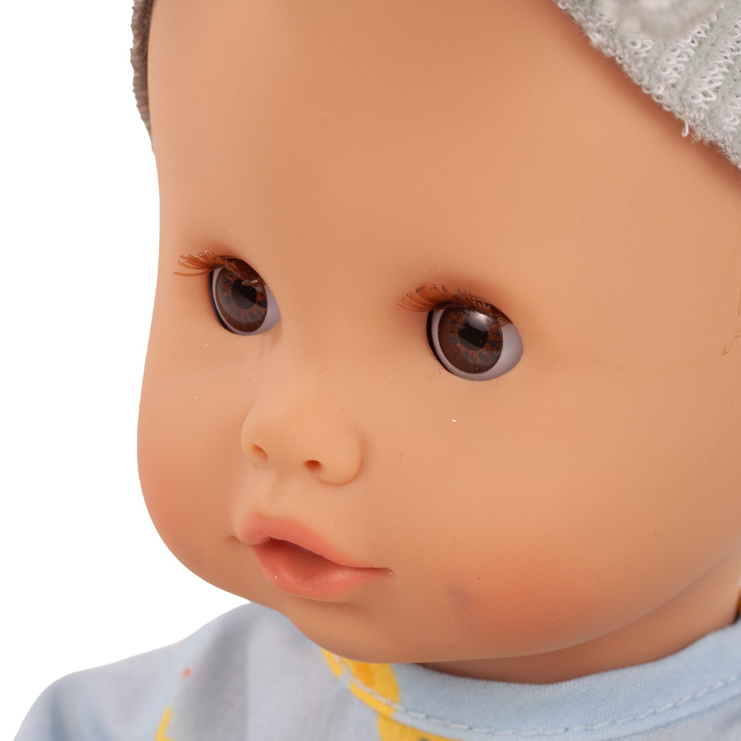 Gotz Sleepy Aquini 13 inch baby doll with brown eyes and white bonnet