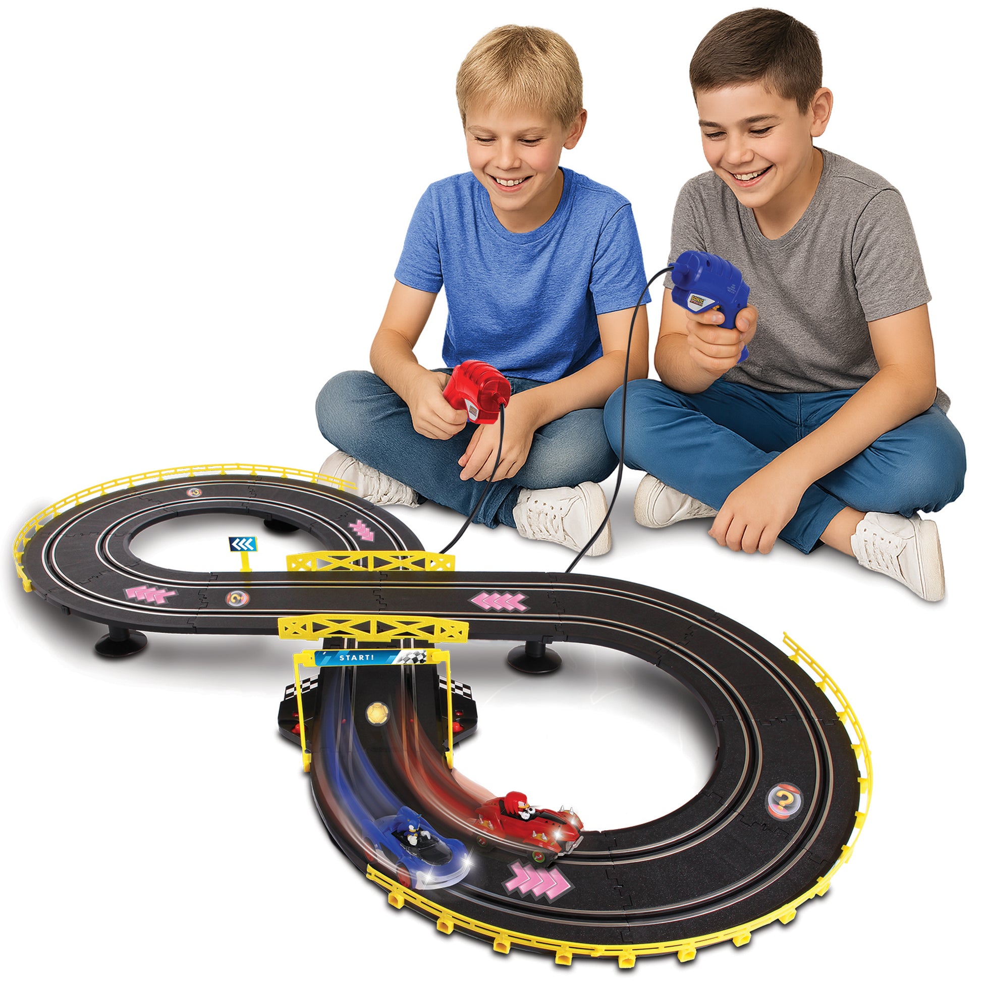 Sonic Crossworlds Slot Car Race Set with two boys racing red and blue Sonic cars on black track