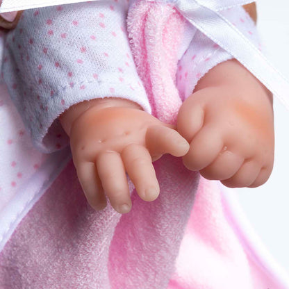 JC Toys La Baby 11 inch soft body doll with caucasian features wearing white and pink outfit