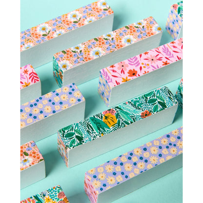 JOS Tumbling Tower with colorful floral patterned wooden blocks on turquoise background