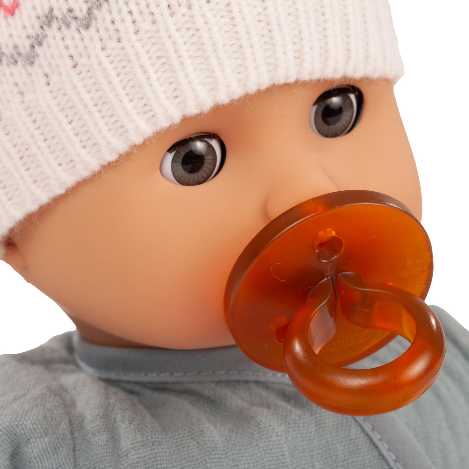 Gotz Muffin Baby Zig Zag 13" doll with white knit hat and orange pacifier