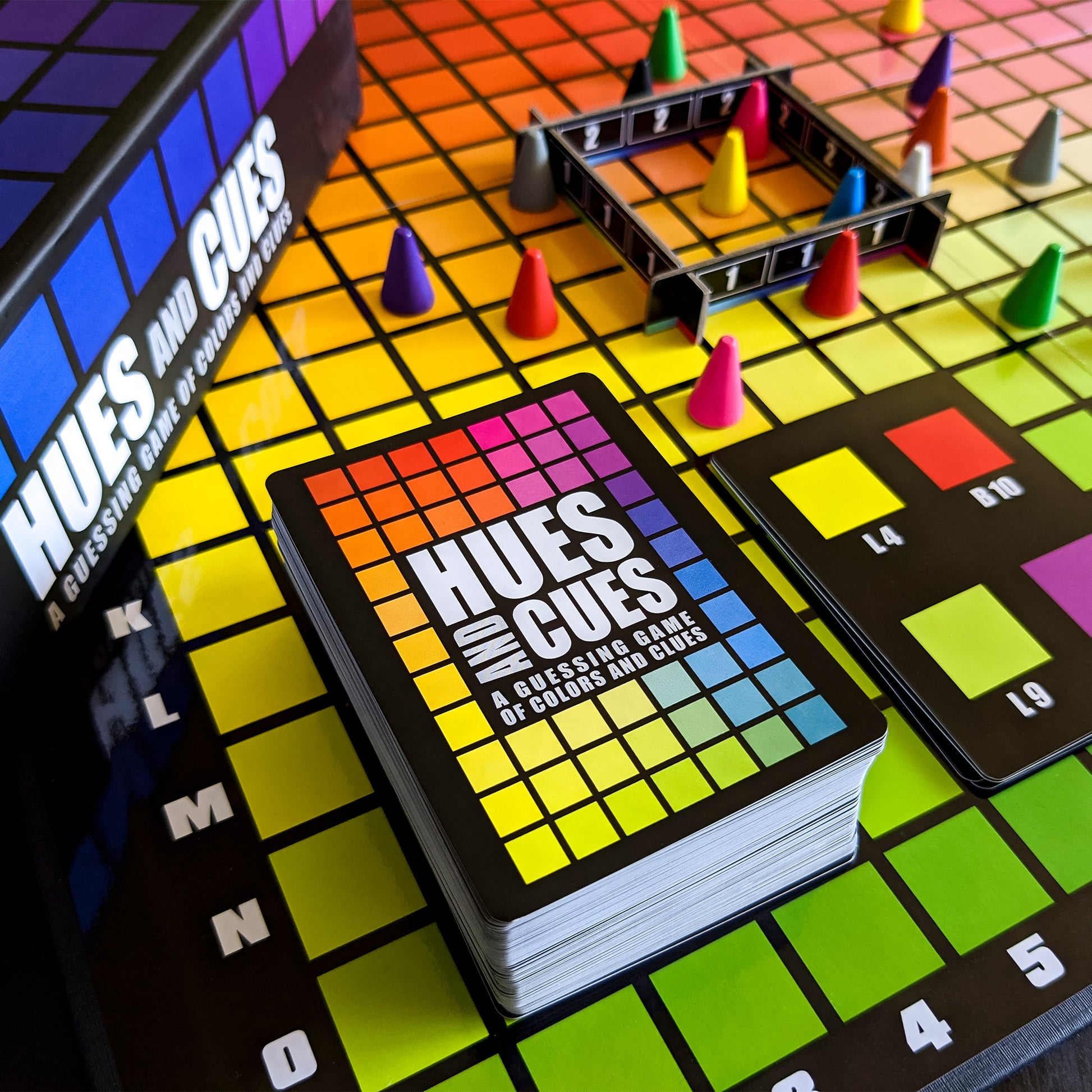 Hues & Cues color guessing board game with colorful game pieces and cards on vibrant grid