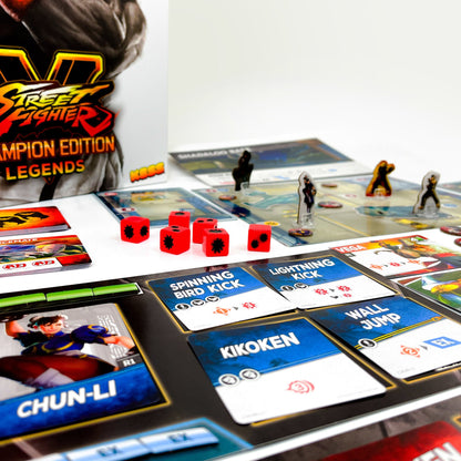 Street Fighter V Champion Edition Legends board game with character cards, red dice, and game boards