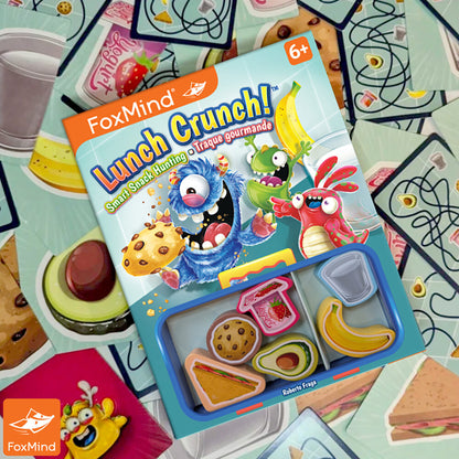 FoxMind Lunch Crunch card game with colorful monster characters and food-themed cards displayed on packaging