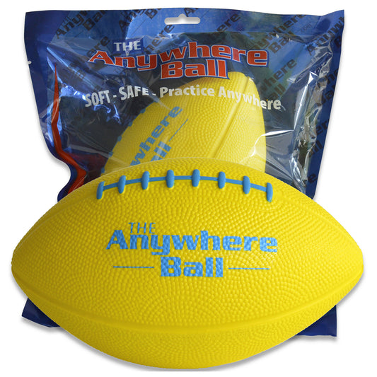 The Anywhere Ball yellow foam football with blue stitching in packaging