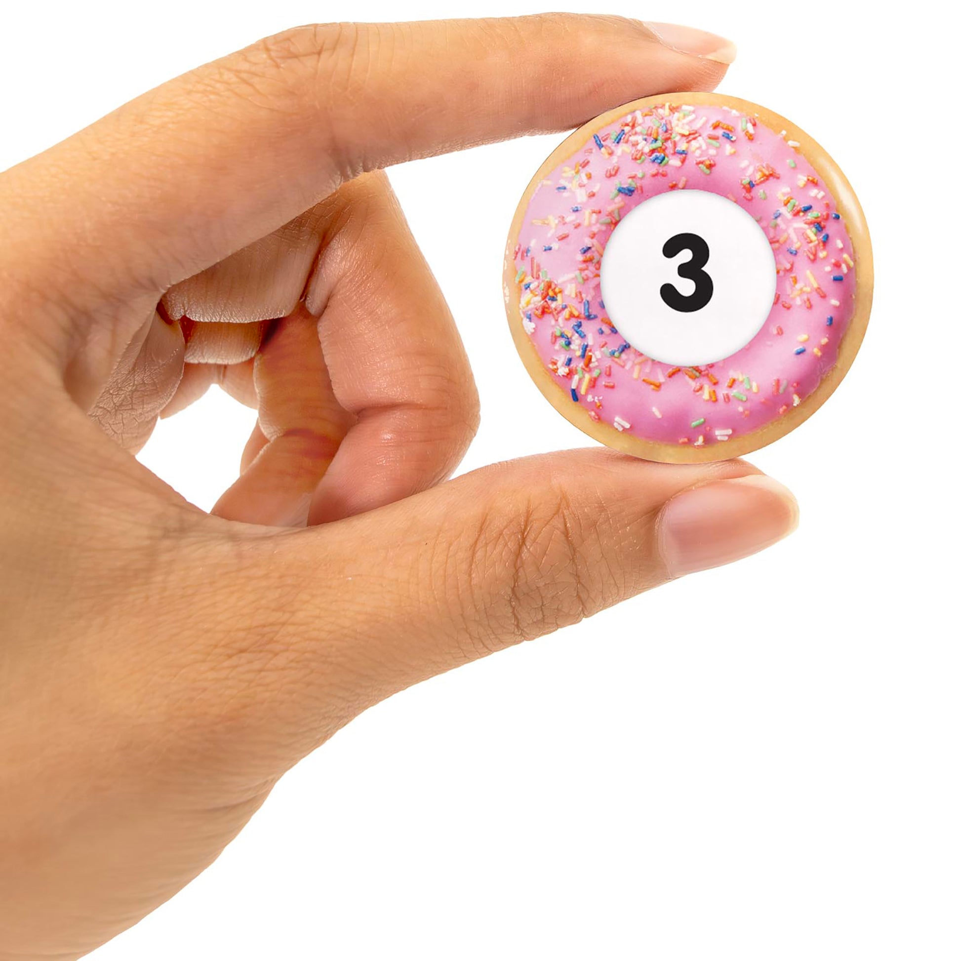 Snacks: Addition toy donut with pink frosting, colorful sprinkles, and number 3